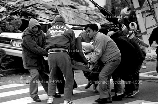 mhc-ghe 195 b2 Where people were pulled alive from the ruins friends and family used anything as a makeshift stretcher to get them to the hastily erected field medical centres, all the time dodging live sparking power cables.