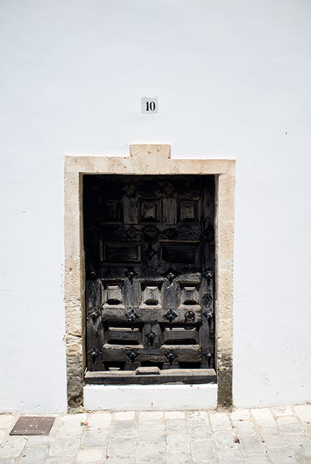 Door in white wall. Door in white wall.