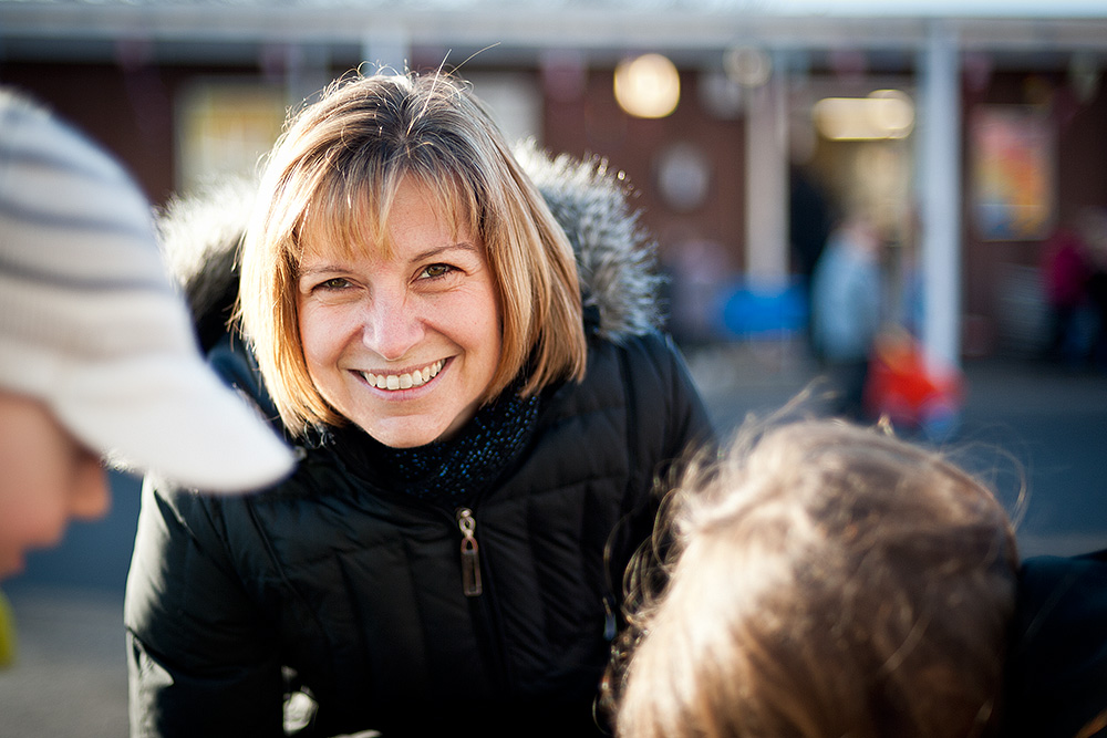 Primary school teacher plays with the children Primary school teacher plays with the children