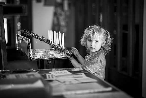 Girl with votive candles